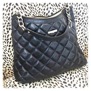 Kate Spade shoulder purse with gold accents.